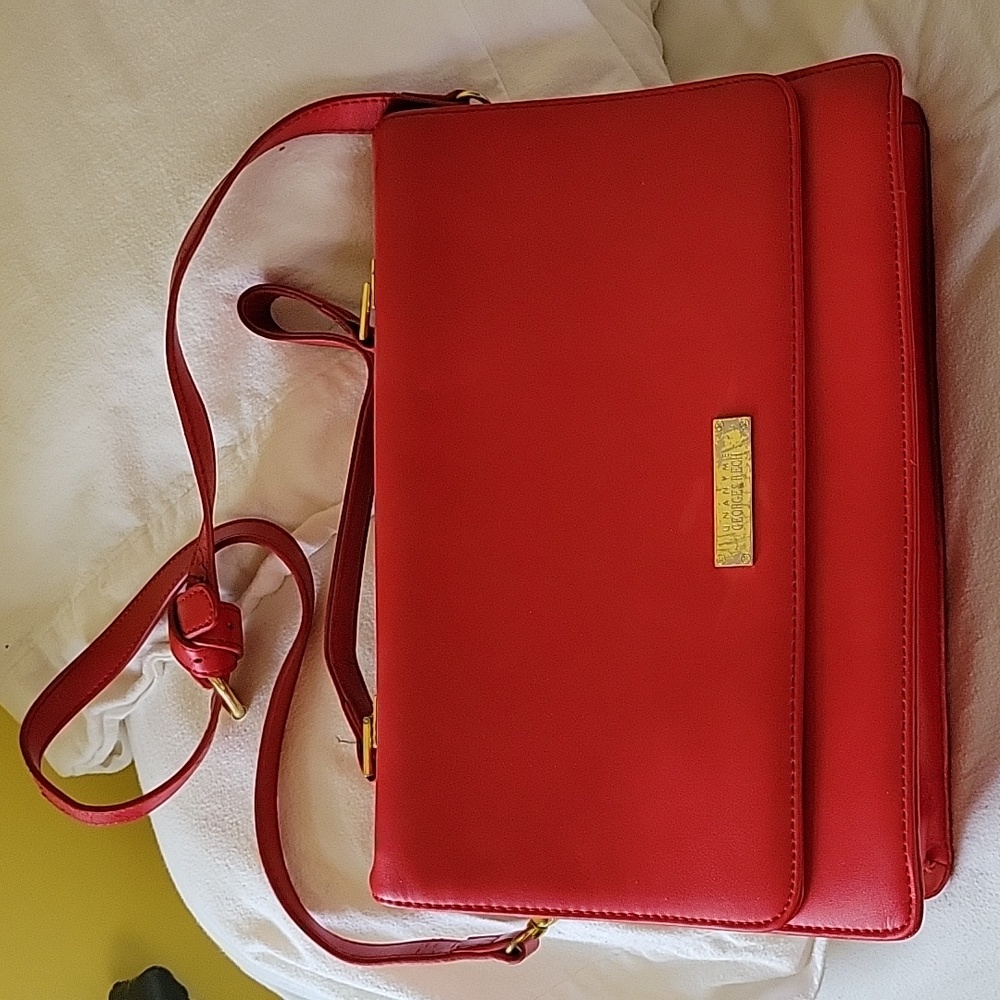 Classic lipstick red shoulder bag with strap and handle.   o/s